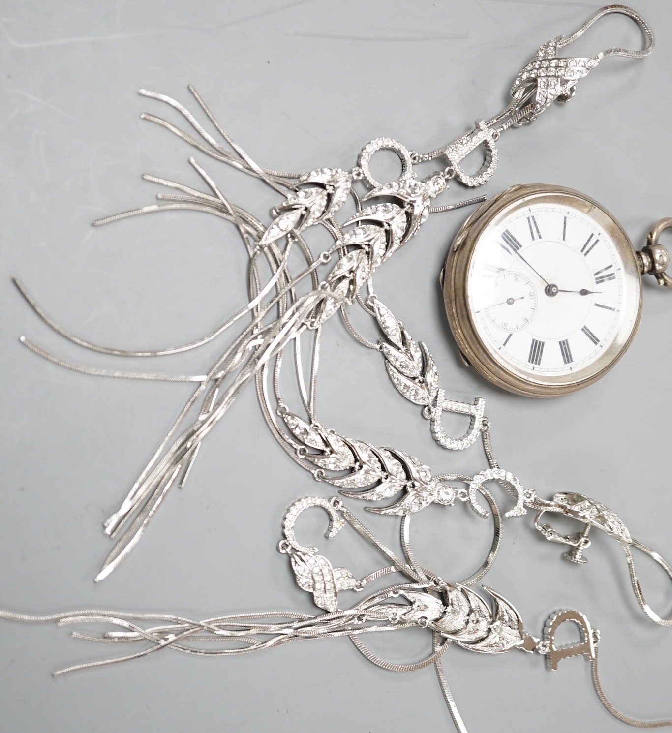 A Victorian silver open faced keywind pocket watch and a paste set suite of jewellery.